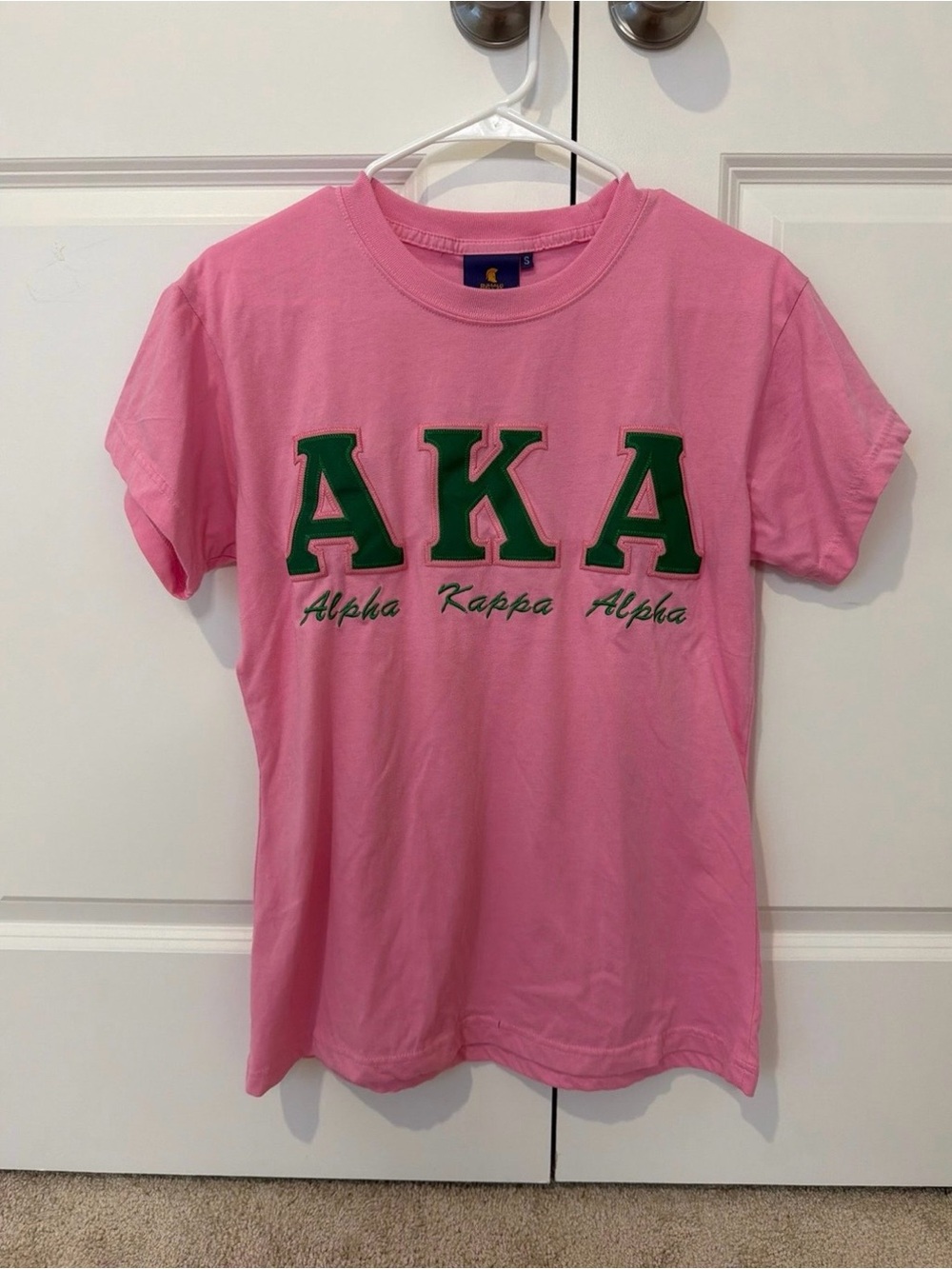 AKA Short Sleeve Graphic Tee in Pink with Green Lettering